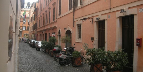 Lena lived on the Via dei Greci. In the heart of what used to be the Ortaccio, or Evil Garden, where only whores and the very poor lived. And artists, of course. Both places are now very expensive spots. But they’re still redolent of C’s time. At night, they’re dark and empty. Though not spooky. I never get spooked in Rome. Too damned happy there.